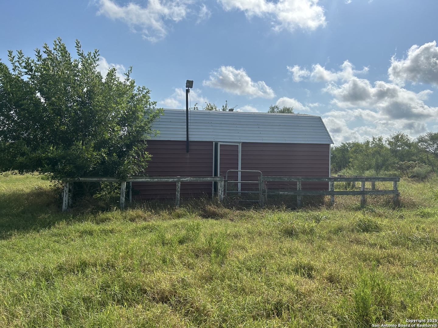 1242 Cologne Road Victoria, TX 77905 - Photo 16 of 29 a backyard of a house with lots of green space and lake view