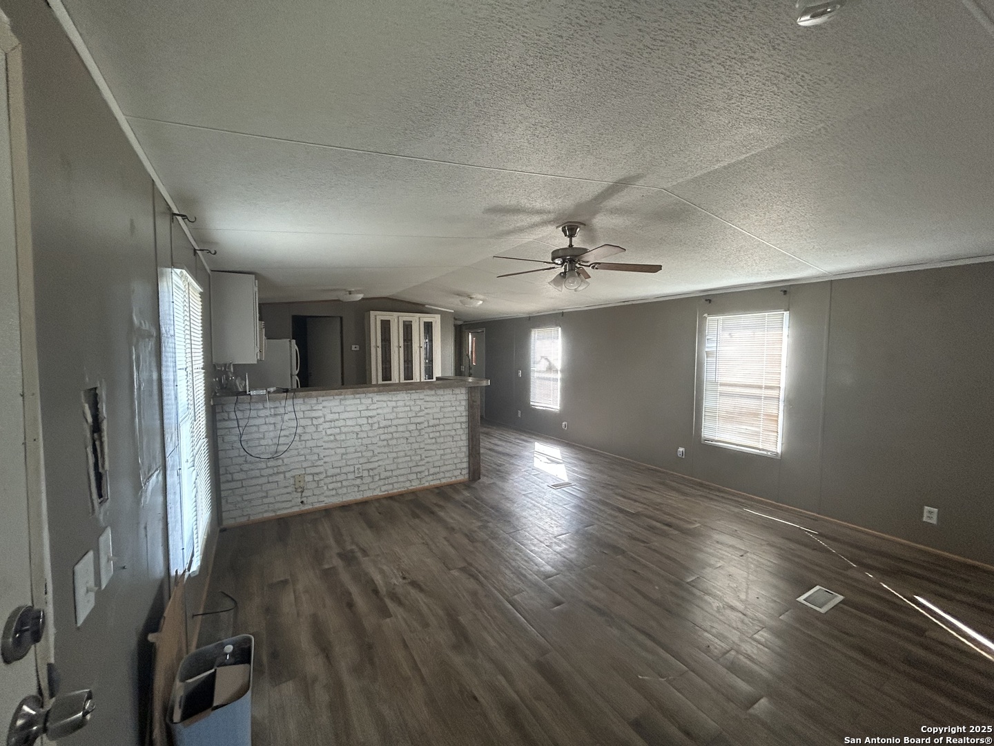 1242 Cologne Road Victoria, TX 77905 - Photo 2 of 29 wooden floor in an empty room with a window