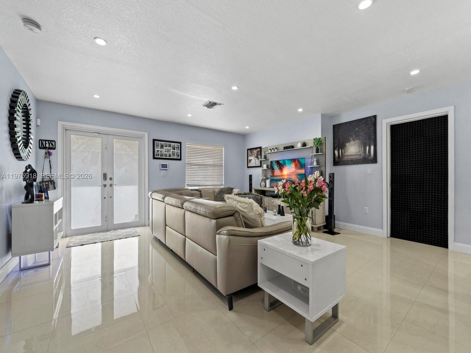 30236 Southwest 148th Place Homestead, FL 33033 - Photo 30 of 69 a living room with furniture and a flat screen tv