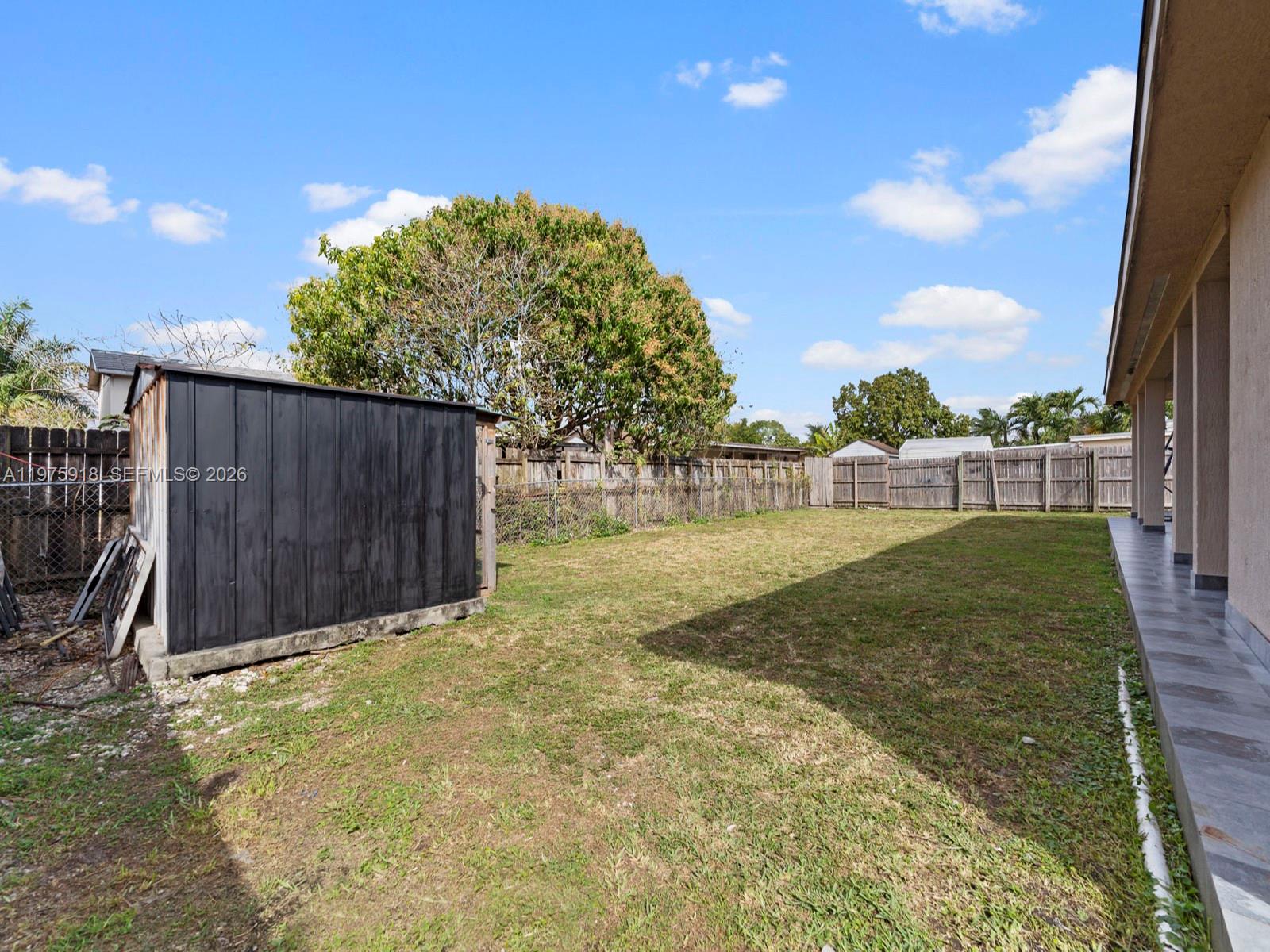 30236 Southwest 148th Place Homestead, FL 33033 - Photo 52 of 69 a view of backyard with barn and a cactus plant