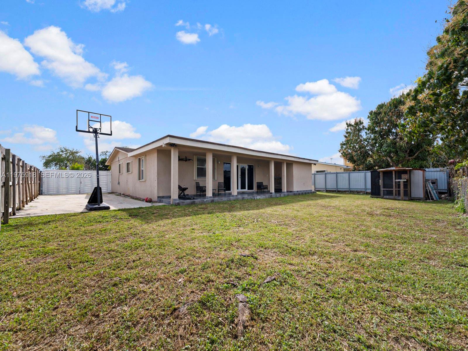 30236 Southwest 148th Place Homestead, FL 33033 - Photo 53 of 69 a view of a house with a backyard