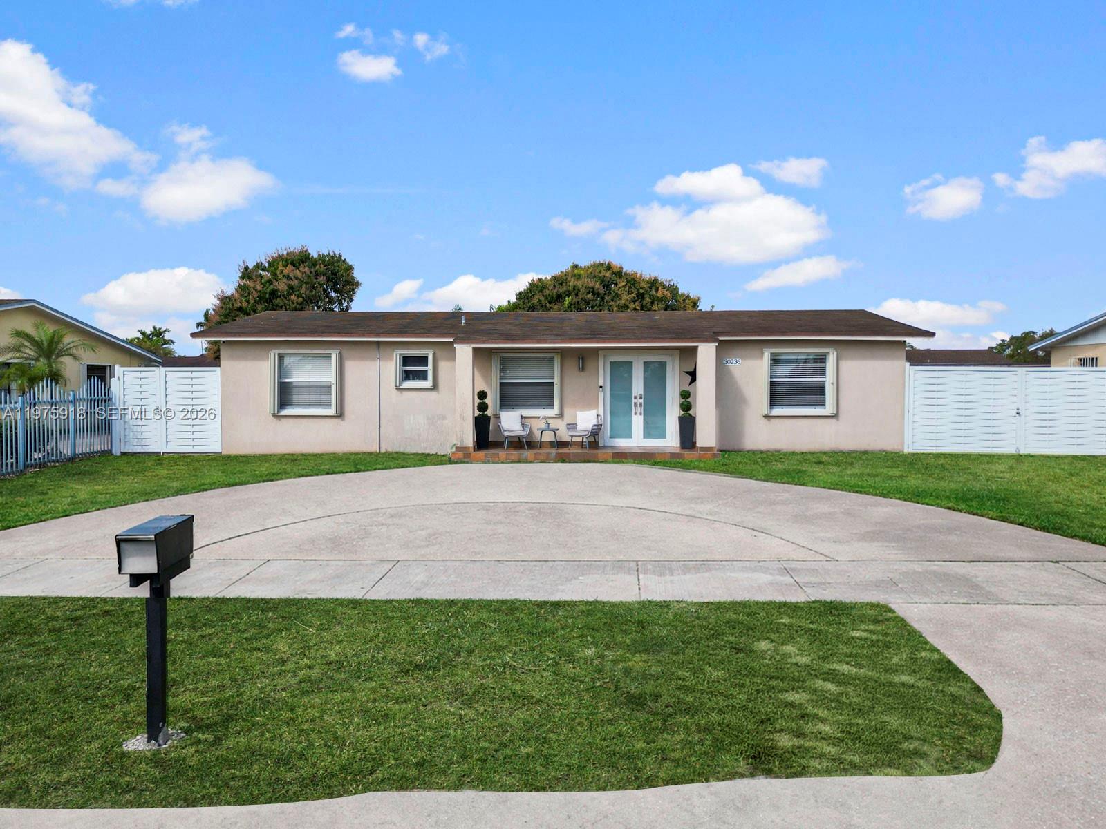 30236 Southwest 148th Place Homestead, FL 33033 - Photo 54 of 69 a view of house in front of a big yard with potted plants