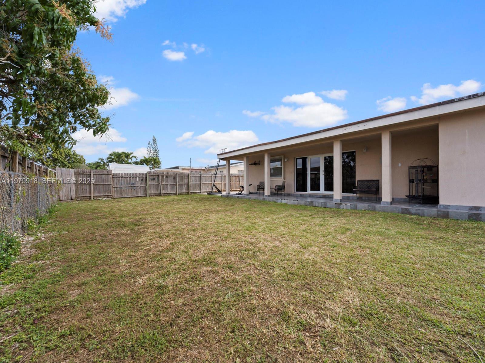 30236 Southwest 148th Place Homestead, FL 33033 - Photo 56 of 69 a view of a house with backyard and porch