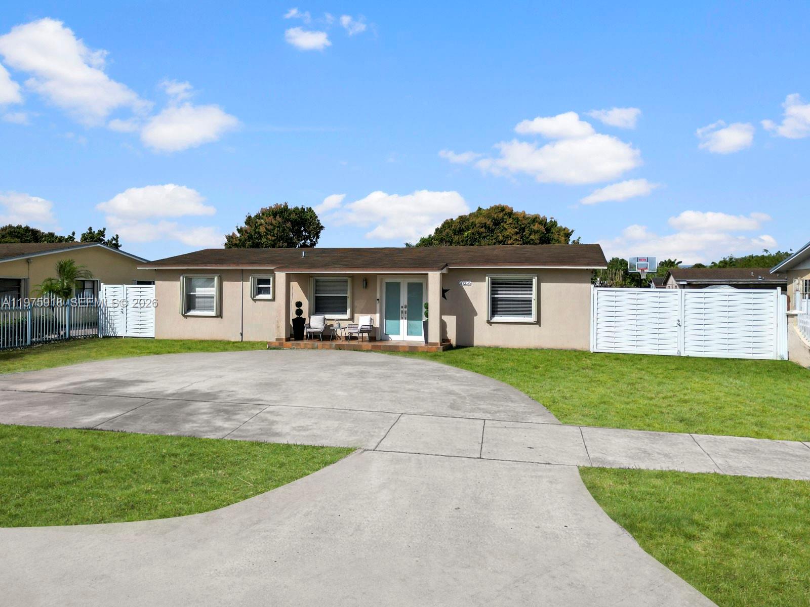 30236 Southwest 148th Place Homestead, FL 33033 - Photo 66 of 69 a front view of a house with a garden