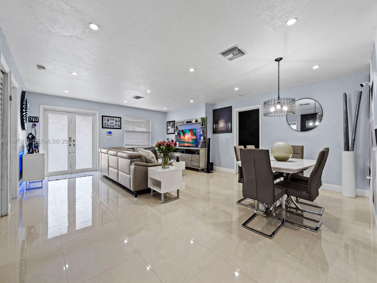30236 Southwest 148th Place Homestead, FL 33033 - Photo 8 of 69 a living room with furniture and kitchen view