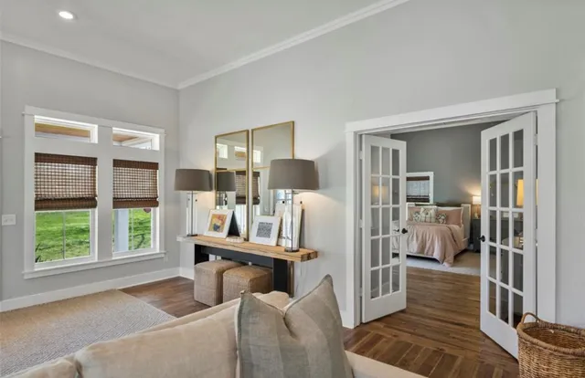 a living room with furniture and large window