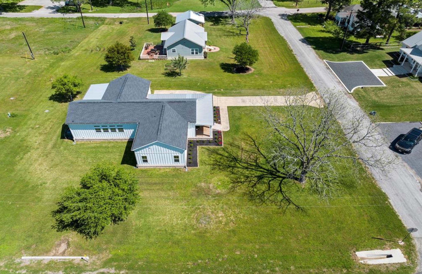 539 Elm Street New Ulm, TX 78950 - Photo 20 of 21 an aerial view of a house with a garden