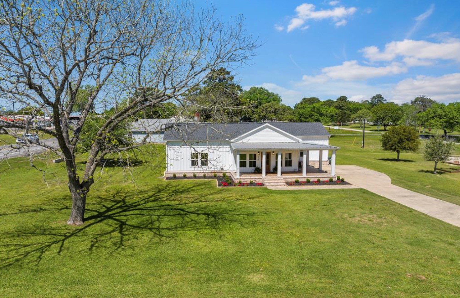 539 Elm Street New Ulm, TX 78950 - Photo 21 of 21 a view of a house with a big yard and large trees