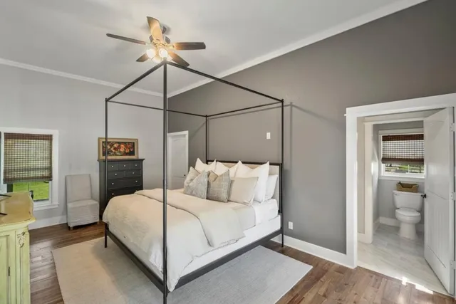 a bedroom with a bed and a walk in closet