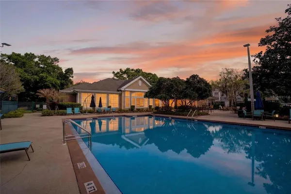 a view of a swimming pool with a patio