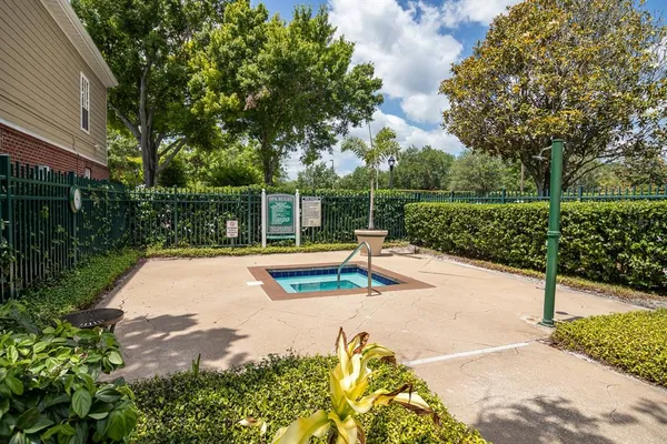 a view of a swimming pool with a patio