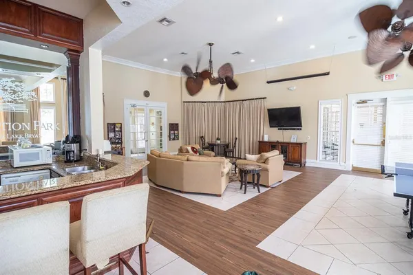 a living room with fireplace furniture and a flat screen tv