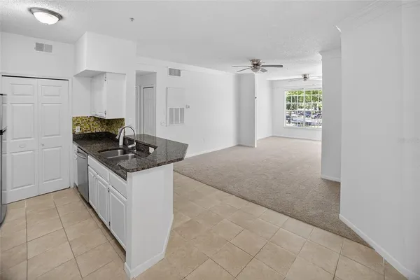 a kitchen with a sink stove and refrigerator