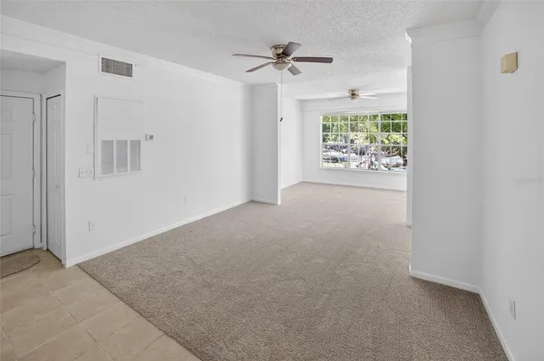 an empty room with windows and entrance