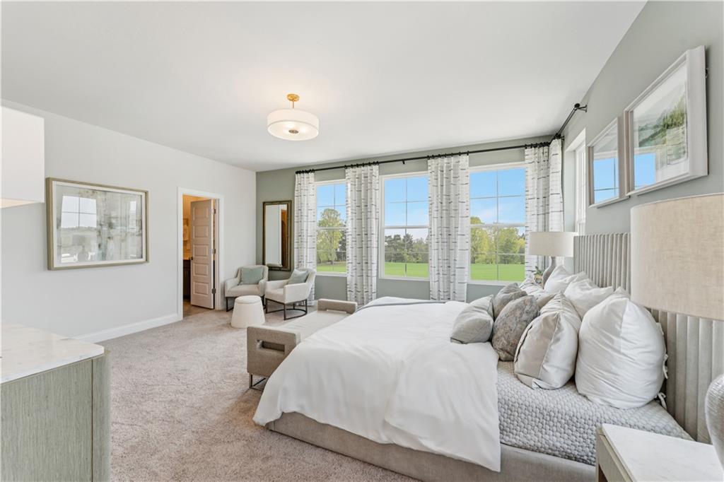 316 Skylar Court Southeast, Unit 94 Atlanta, GA 30312 - Photo 11 of 30 a bed room with a bed and a couch