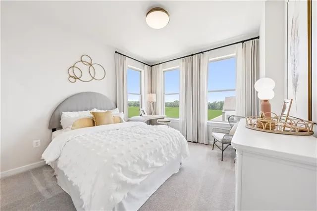 a bedroom with a bed and a table