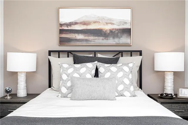a large white bed in a white room