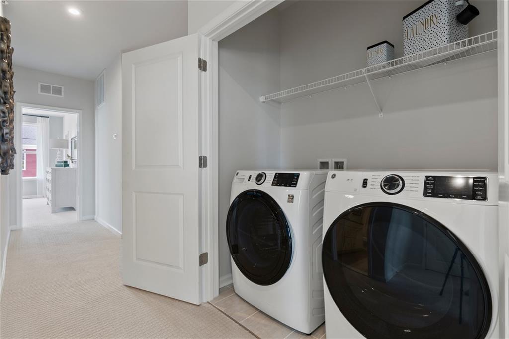316 Skylar Court Southeast, Unit 94 Atlanta, GA 30312 - Photo 21 of 30 a utility room with dryer and washer