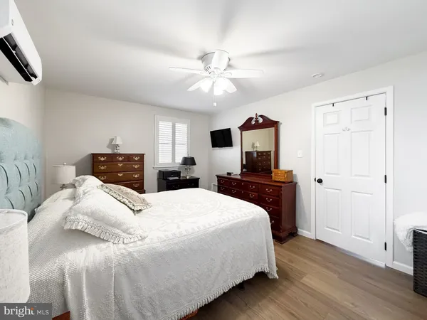 a bedroom with a bed and a tv