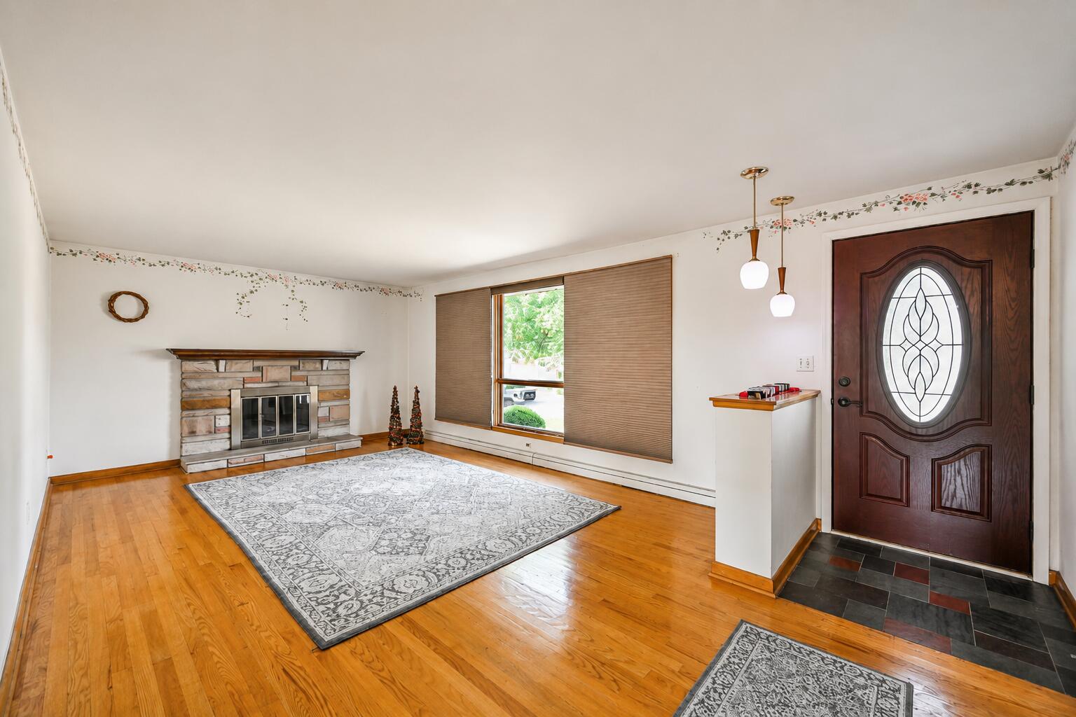 4428 Phoenix Drive Springfield, OH 45503 - Photo 5 of 35 Original hardwood floors cover the main living areas. The large living room makes the perfect gathering spot
