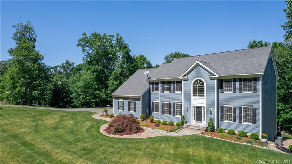 6 Meridian Ridge Drive Newtown, CT 06470 - Photo 1 of 1 a front view of a house with a yard