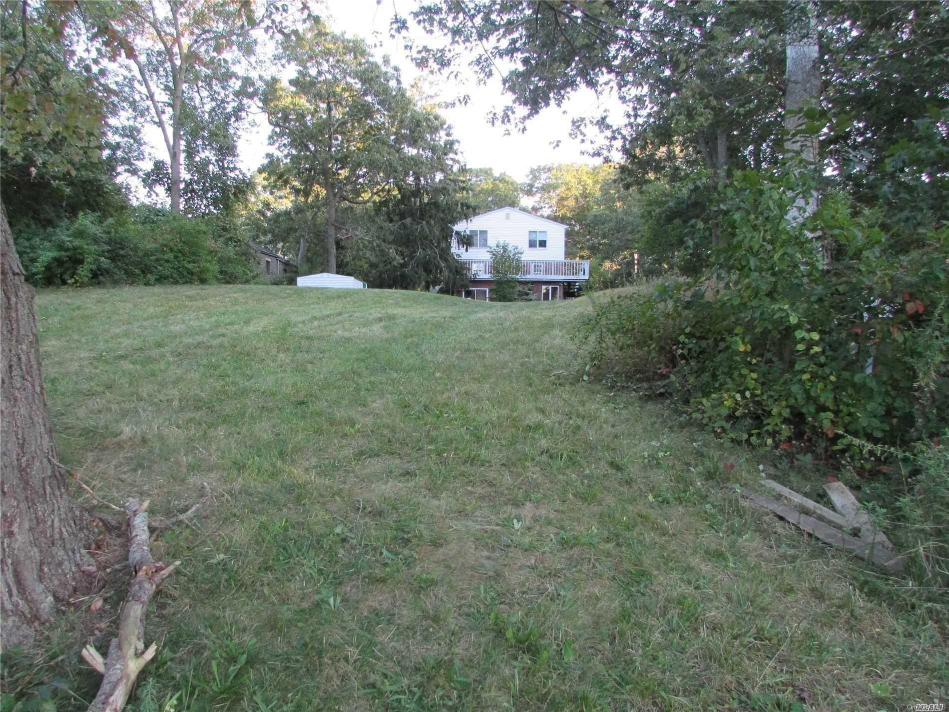 a view of a tiny house with a yard