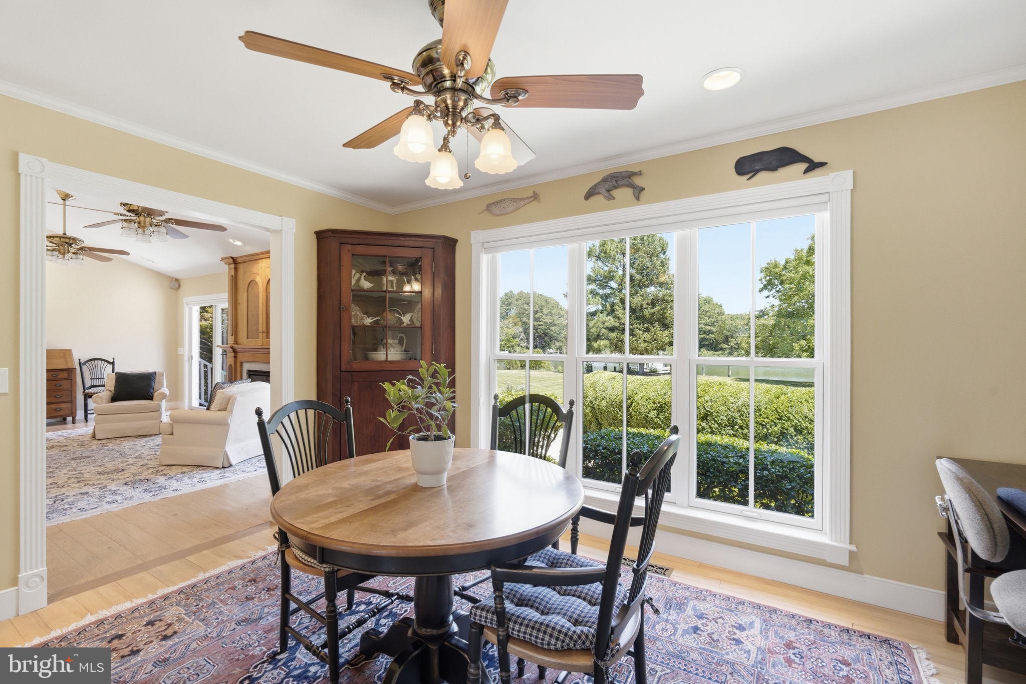 26226 Langs Landing Road Oxford, MD 21654 - Photo 15 of 48 a view of a dining room with furniture window and outside view