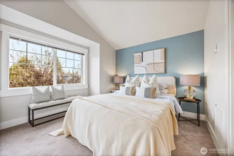 a bedroom with a bed and a view of bathroom