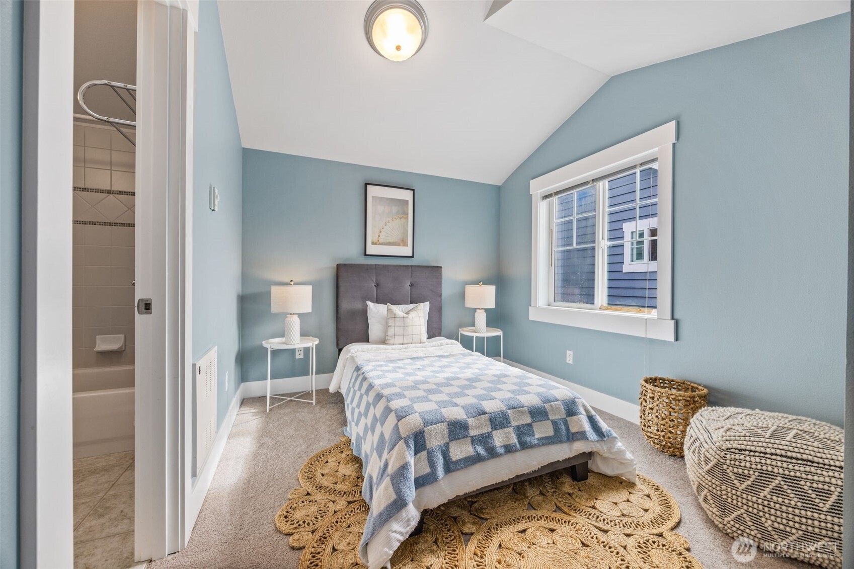 910 Northwest 85th Street, Unit B Seattle, WA 98117 - Photo 17 of 21 a bedroom with a bed and a window