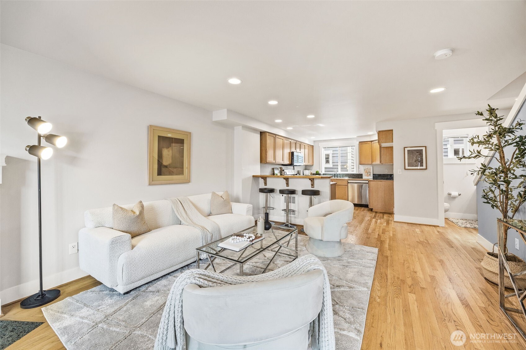 910 Northwest 85th Street, Unit B Seattle, WA 98117 - Photo 7 of 21 a living room with furniture and a wooden floor