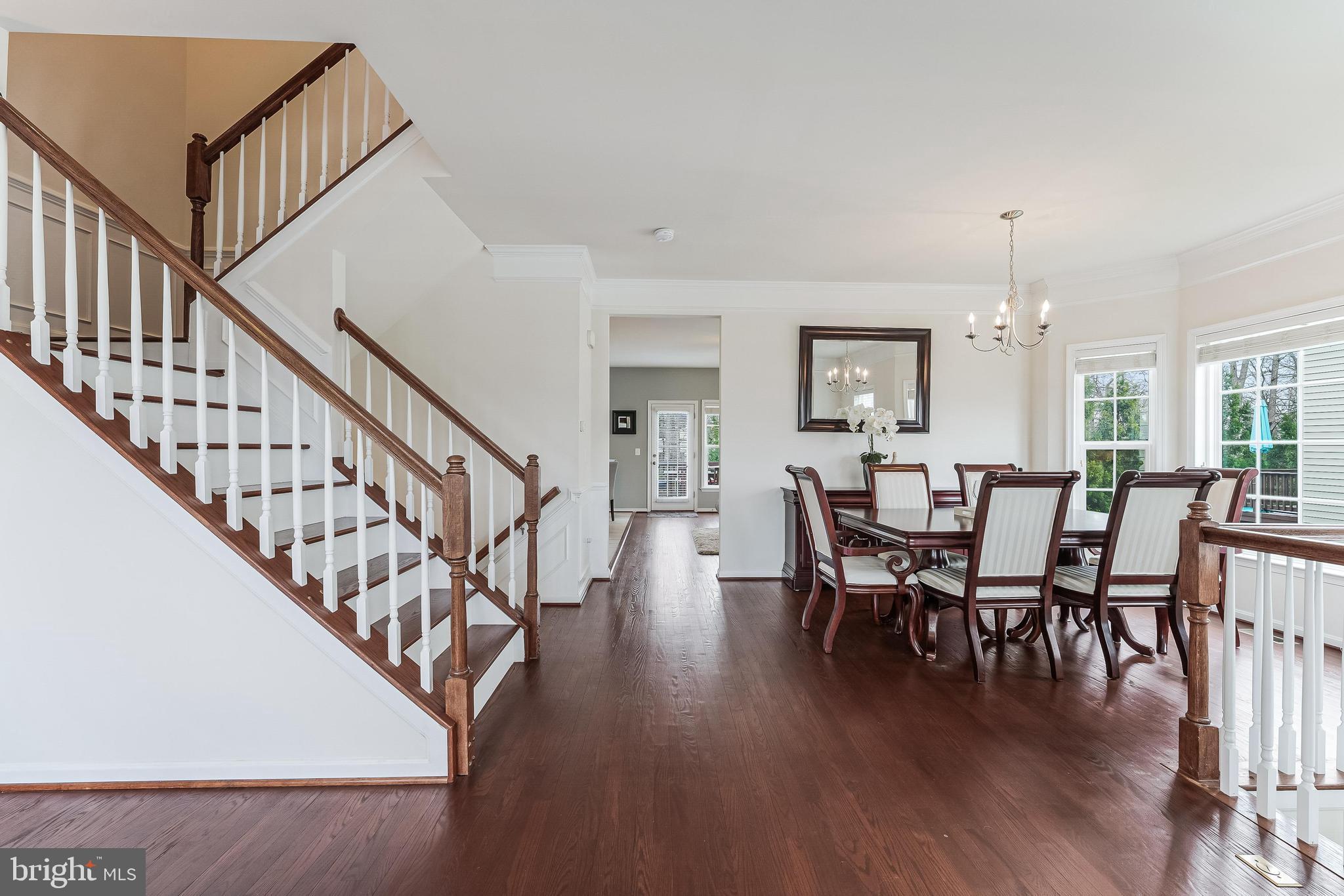42467 Patrick Wayne Square Ashburn, VA 20148 - Photo 13 of 60 a view of a dining room with furniture window and wooden floor