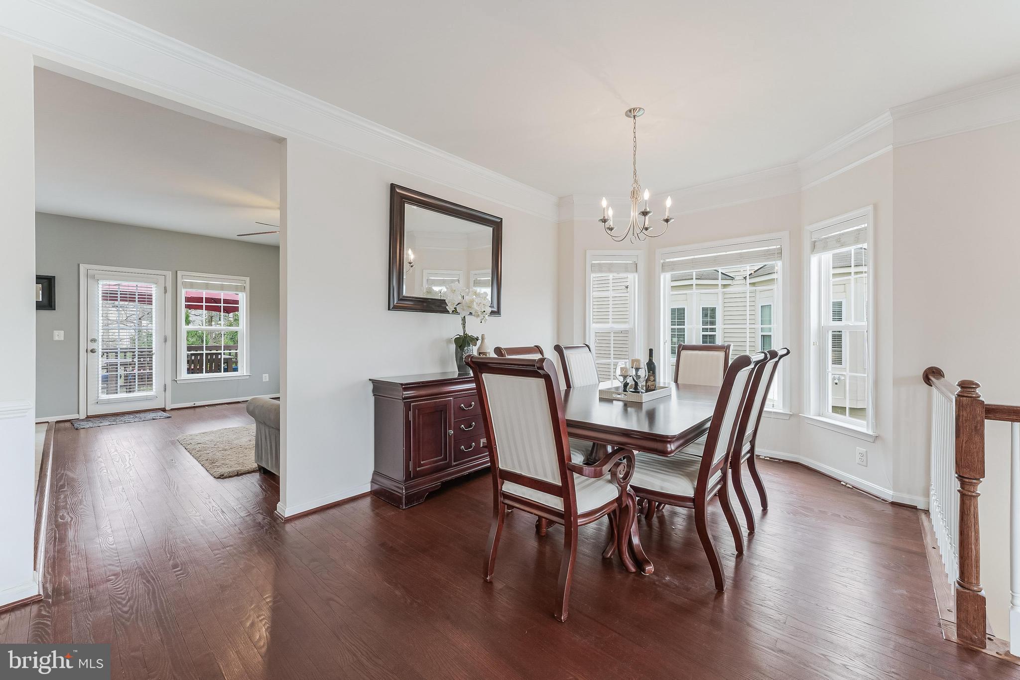 42467 Patrick Wayne Square Ashburn, VA 20148 - Photo 14 of 60 a view of a dining room with furniture window and wooden floor