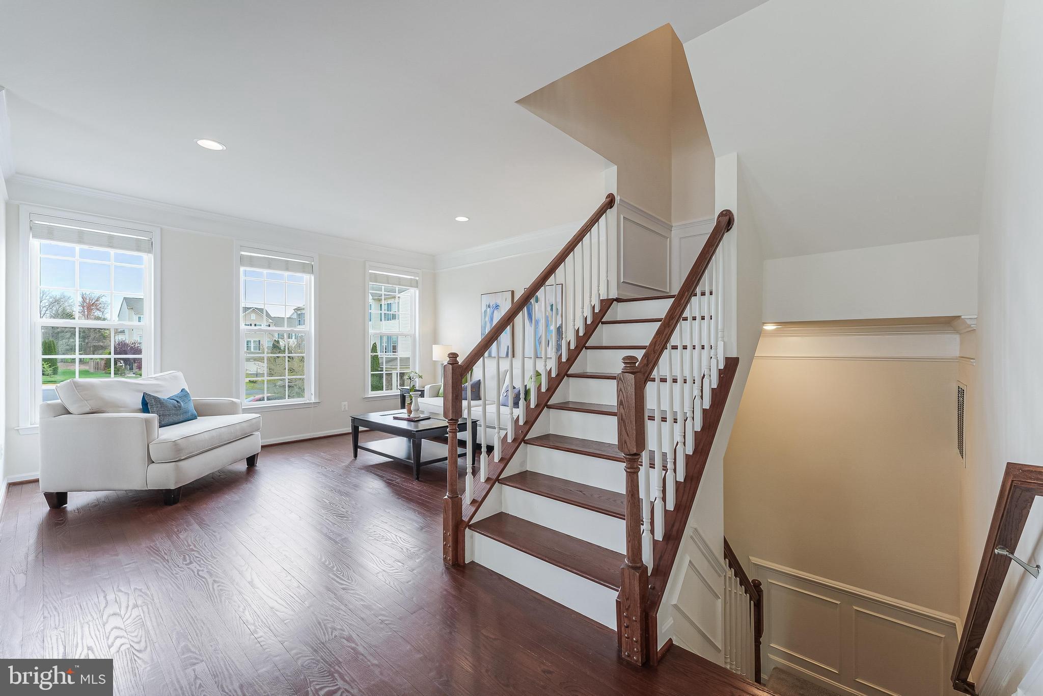 42467 Patrick Wayne Square Ashburn, VA 20148 - Photo 57 of 60 a view of entryway and hall with wooden floor
