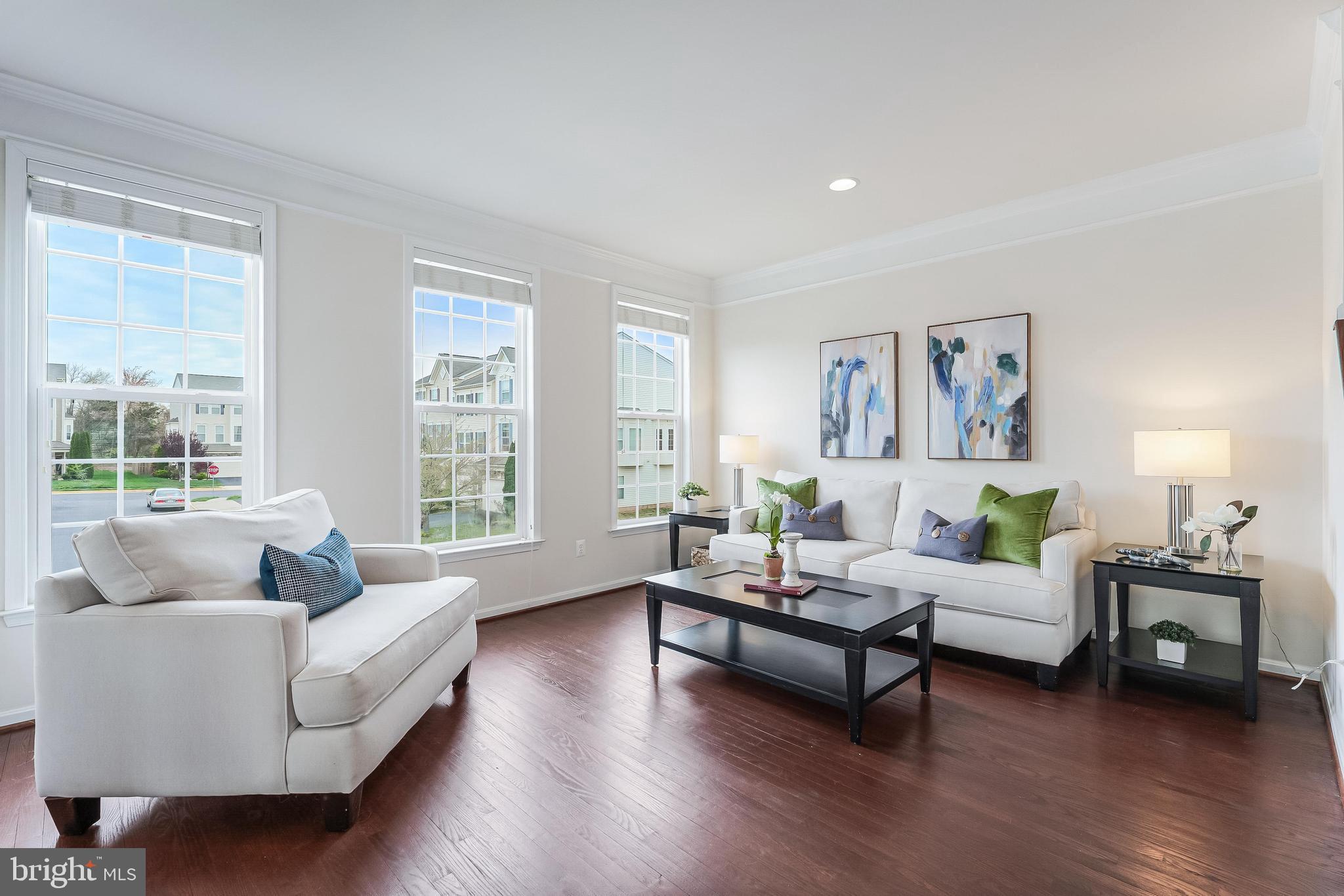 42467 Patrick Wayne Square Ashburn, VA 20148 - Photo 16 of 60 a living room with furniture and a large window