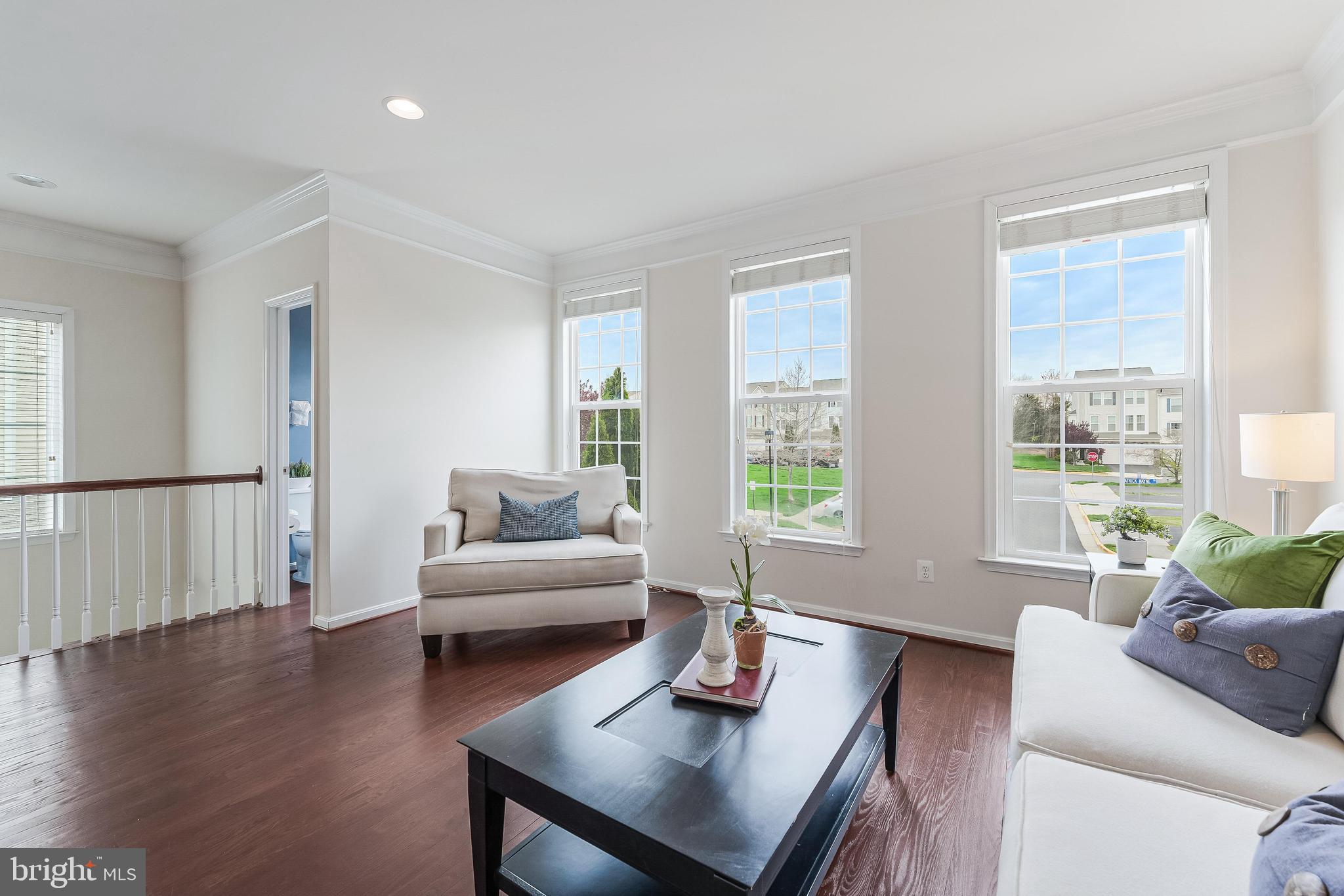 42467 Patrick Wayne Square Ashburn, VA 20148 - Photo 17 of 60 a living room with furniture and a large window