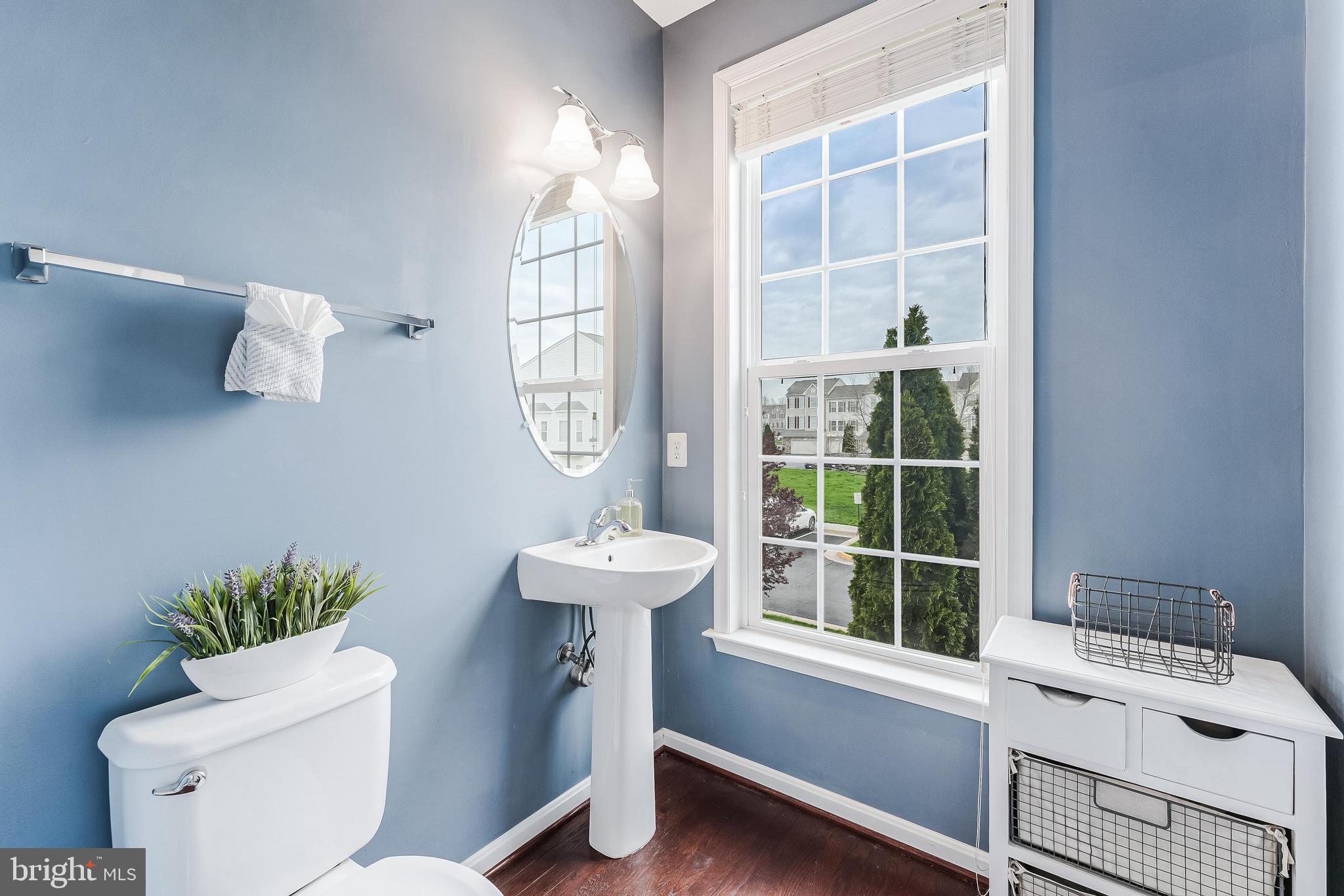 42467 Patrick Wayne Square Ashburn, VA 20148 - Photo 18 of 60 a bathroom with a sink a toilet and a window