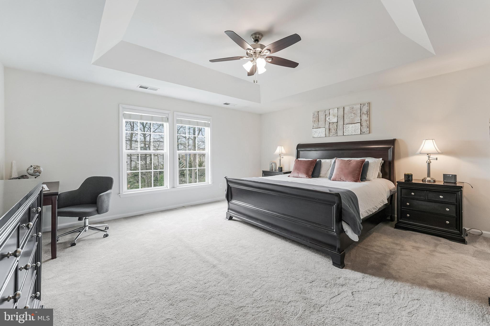 42467 Patrick Wayne Square Ashburn, VA 20148 - Photo 21 of 60 a bedroom with a bed and a large window