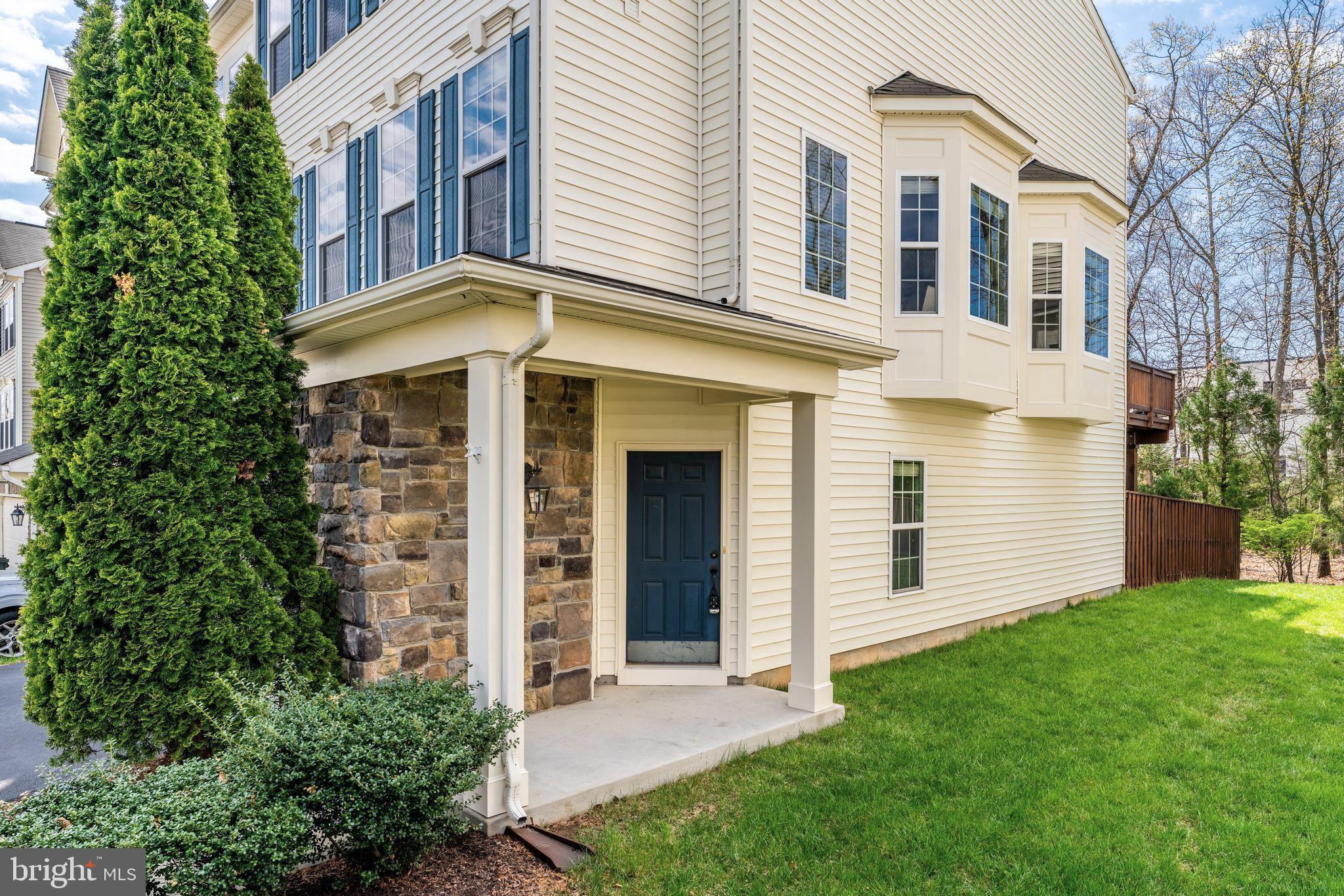 42467 Patrick Wayne Square Ashburn, VA 20148 - Photo 3 of 60 front view of a house with a yard