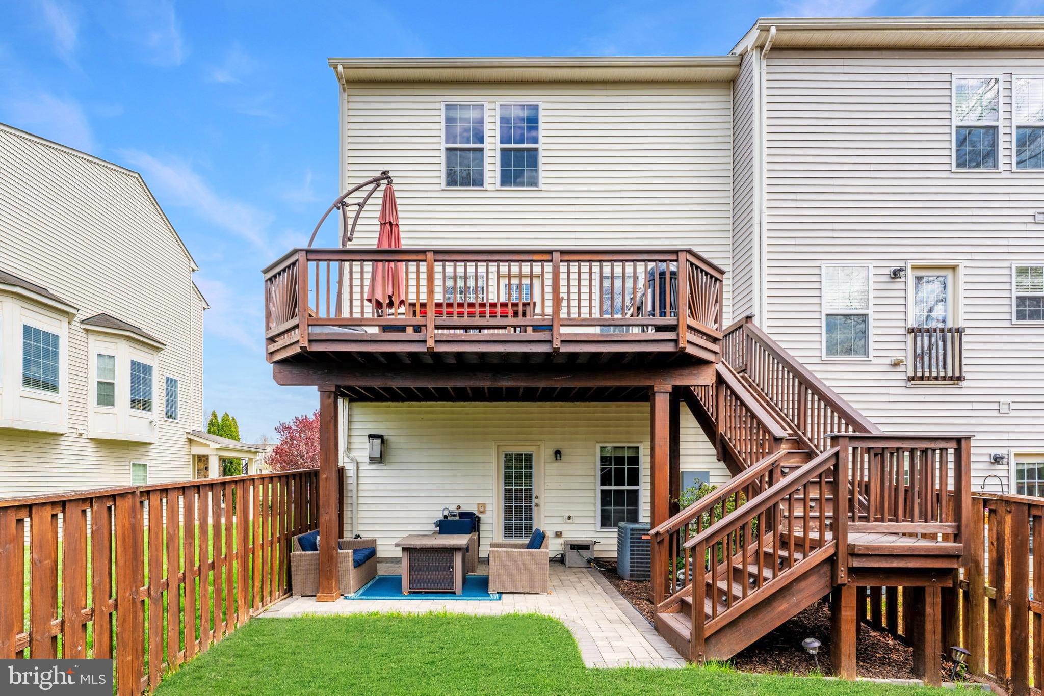 42467 Patrick Wayne Square Ashburn, VA 20148 - Photo 40 of 60 a view of a house with wooden deck and furniture