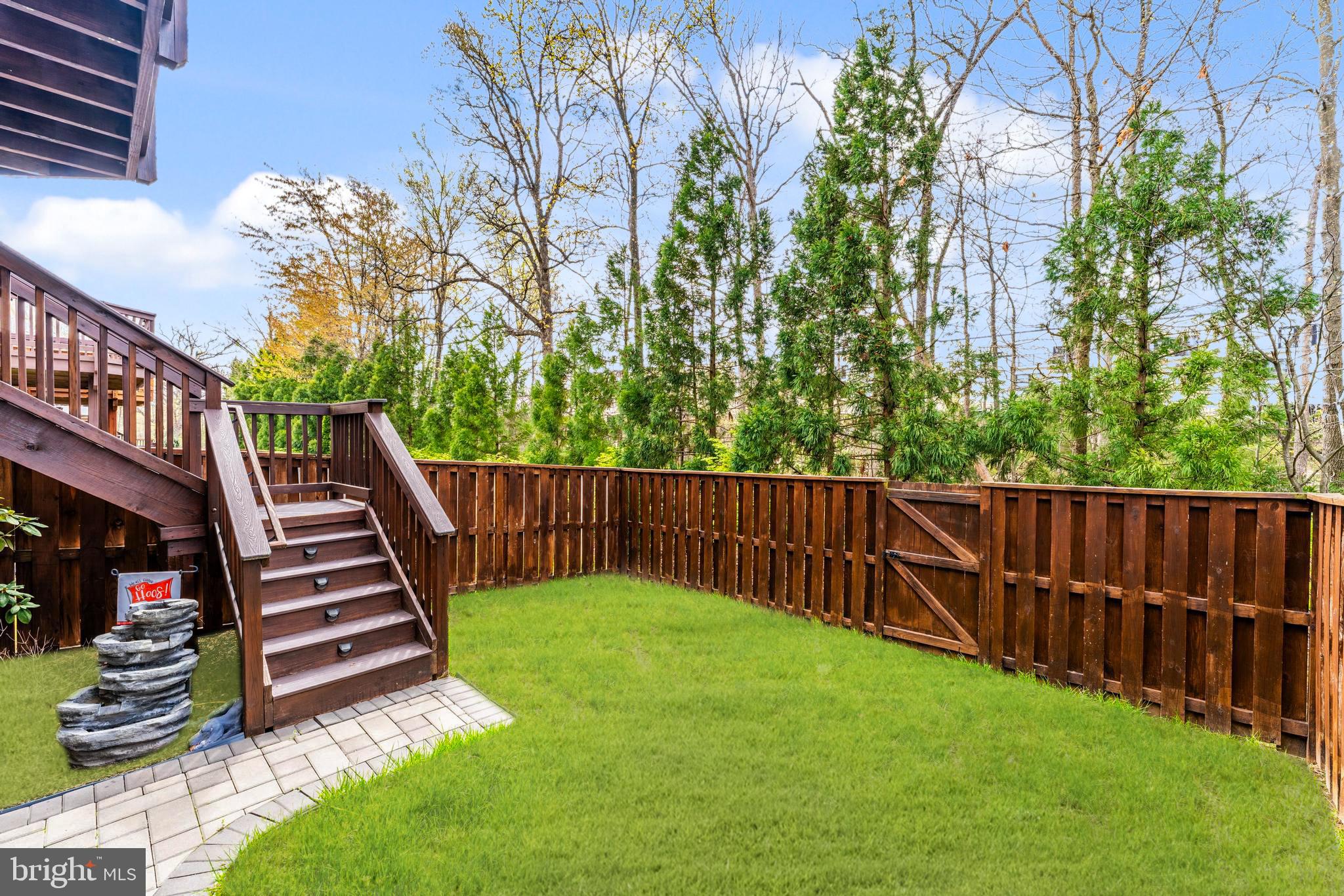 42467 Patrick Wayne Square Ashburn, VA 20148 - Photo 43 of 60 a view of a yard with wooden fence
