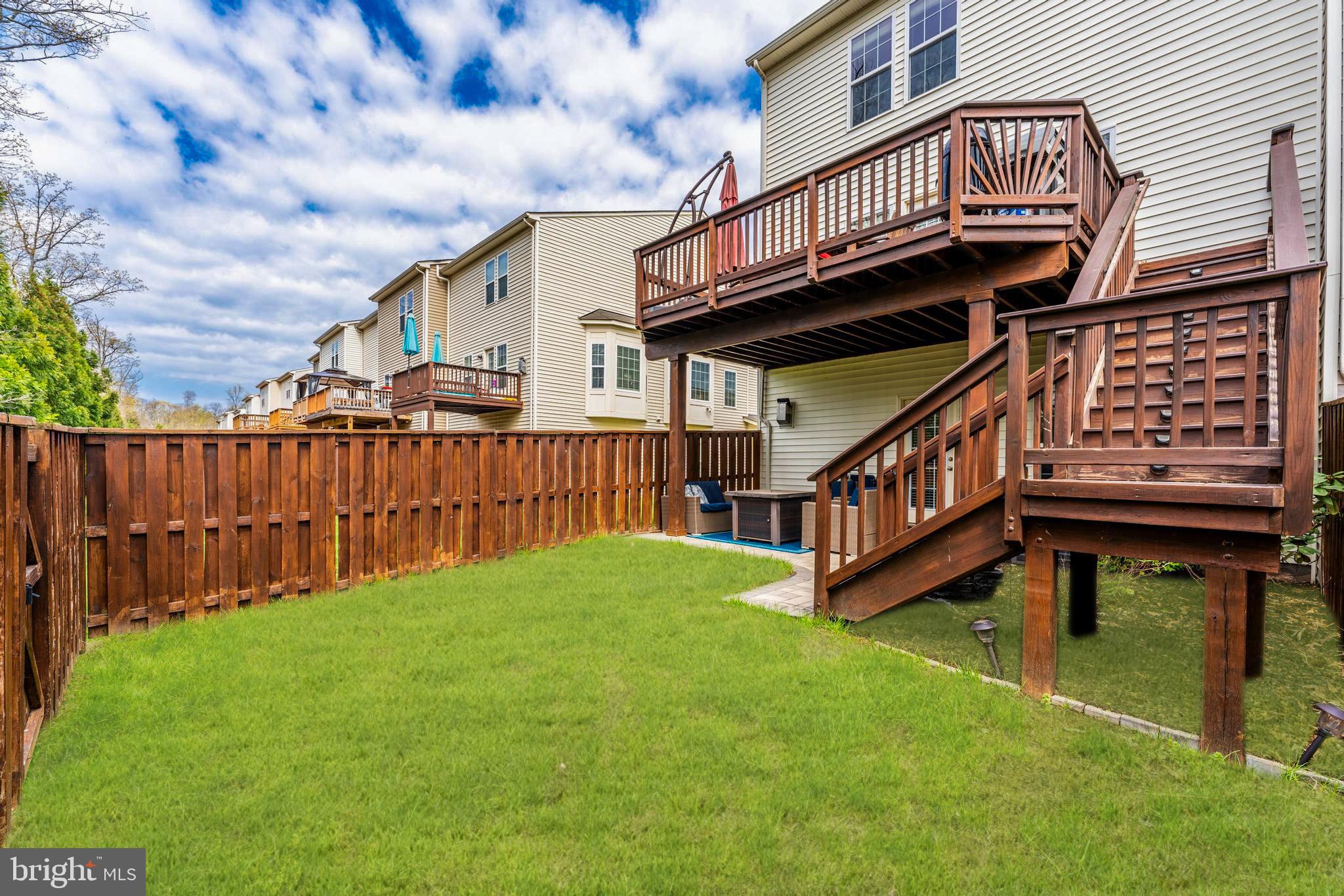 42467 Patrick Wayne Square Ashburn, VA 20148 - Photo 45 of 60 a view of a house with wooden deck