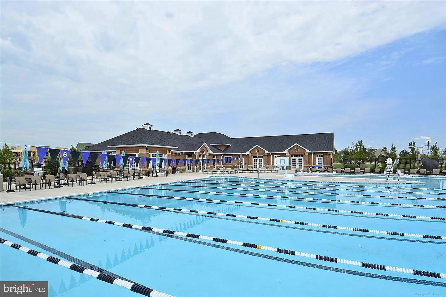 42467 Patrick Wayne Square Ashburn, VA 20148 - Photo 49 of 60 a front view of a house with a yard