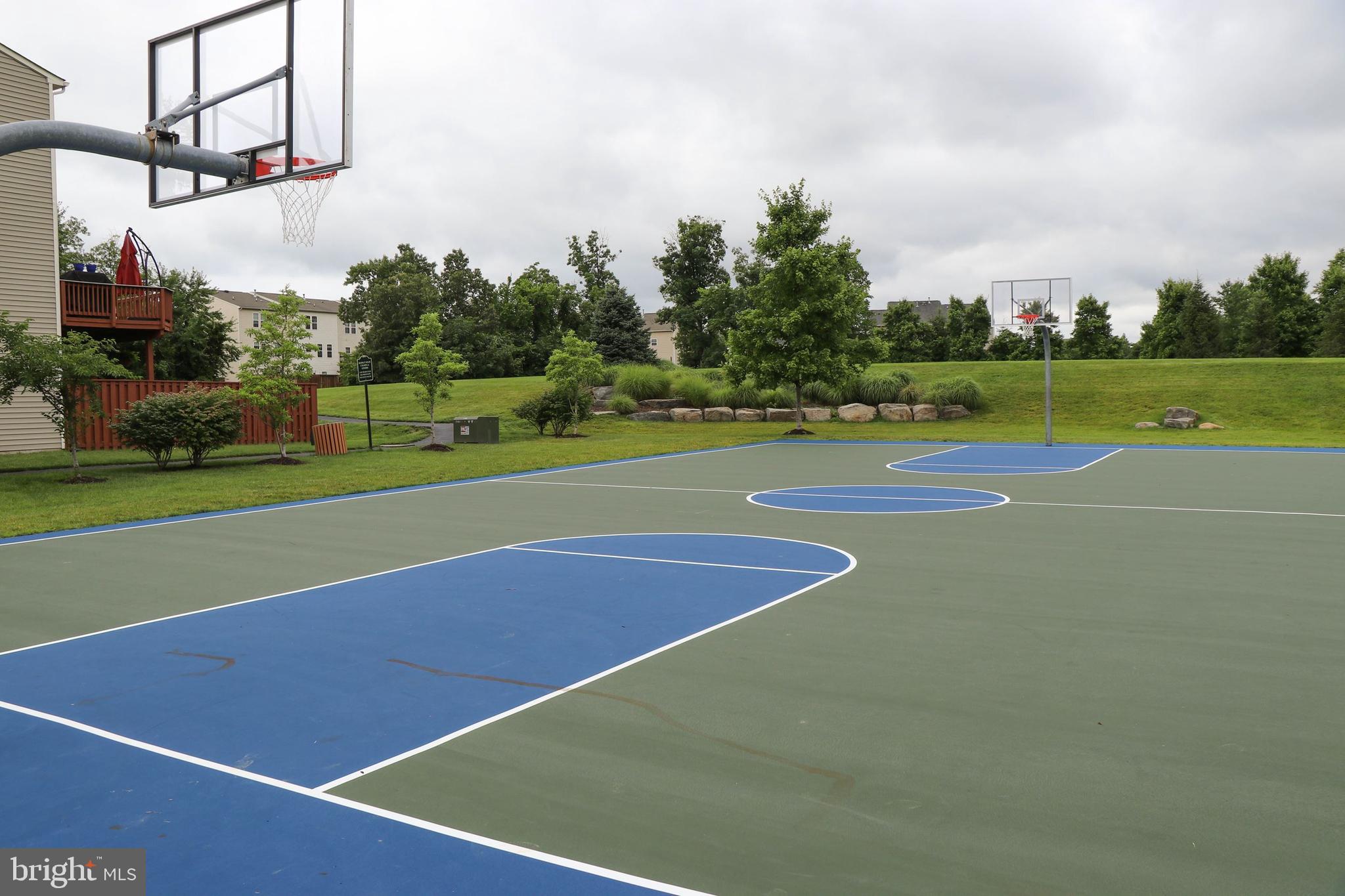42467 Patrick Wayne Square Ashburn, VA 20148 - Photo 50 of 60 a view of a tennis court