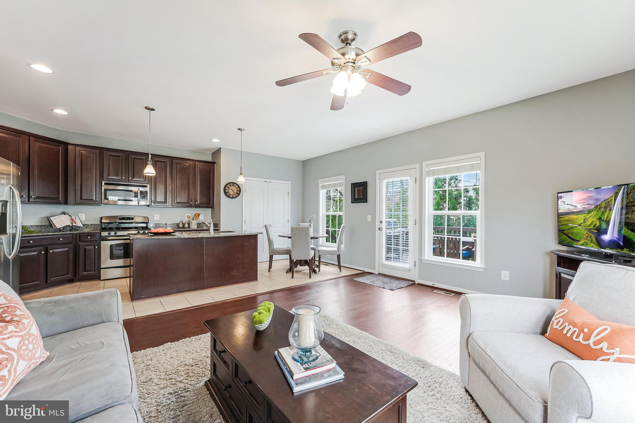 42467 Patrick Wayne Square Ashburn, VA 20148 - Photo 10 of 60 a living room with furniture and a wooden floor
