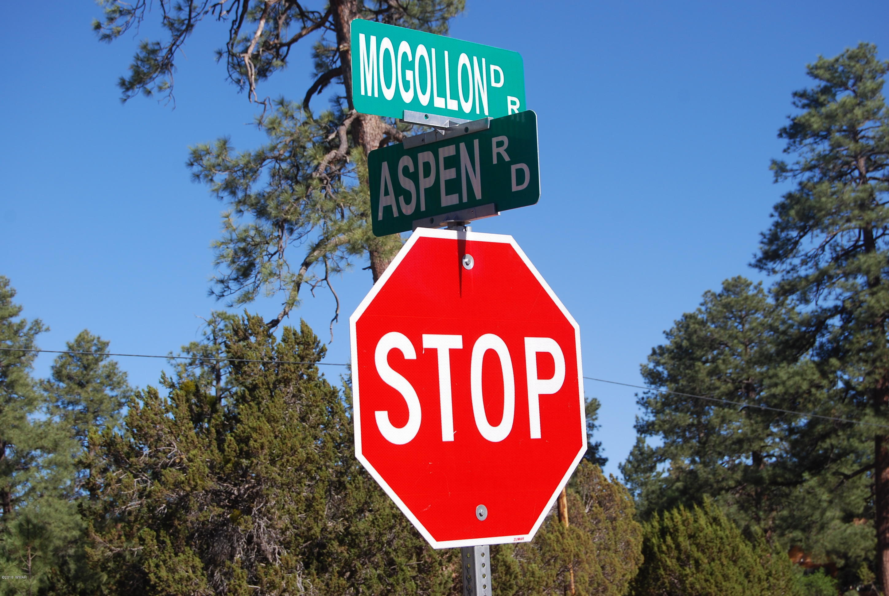 3073 Aspen Road Overgaard, AZ 85933 - Photo 17 of 17 a sign that is on a pole