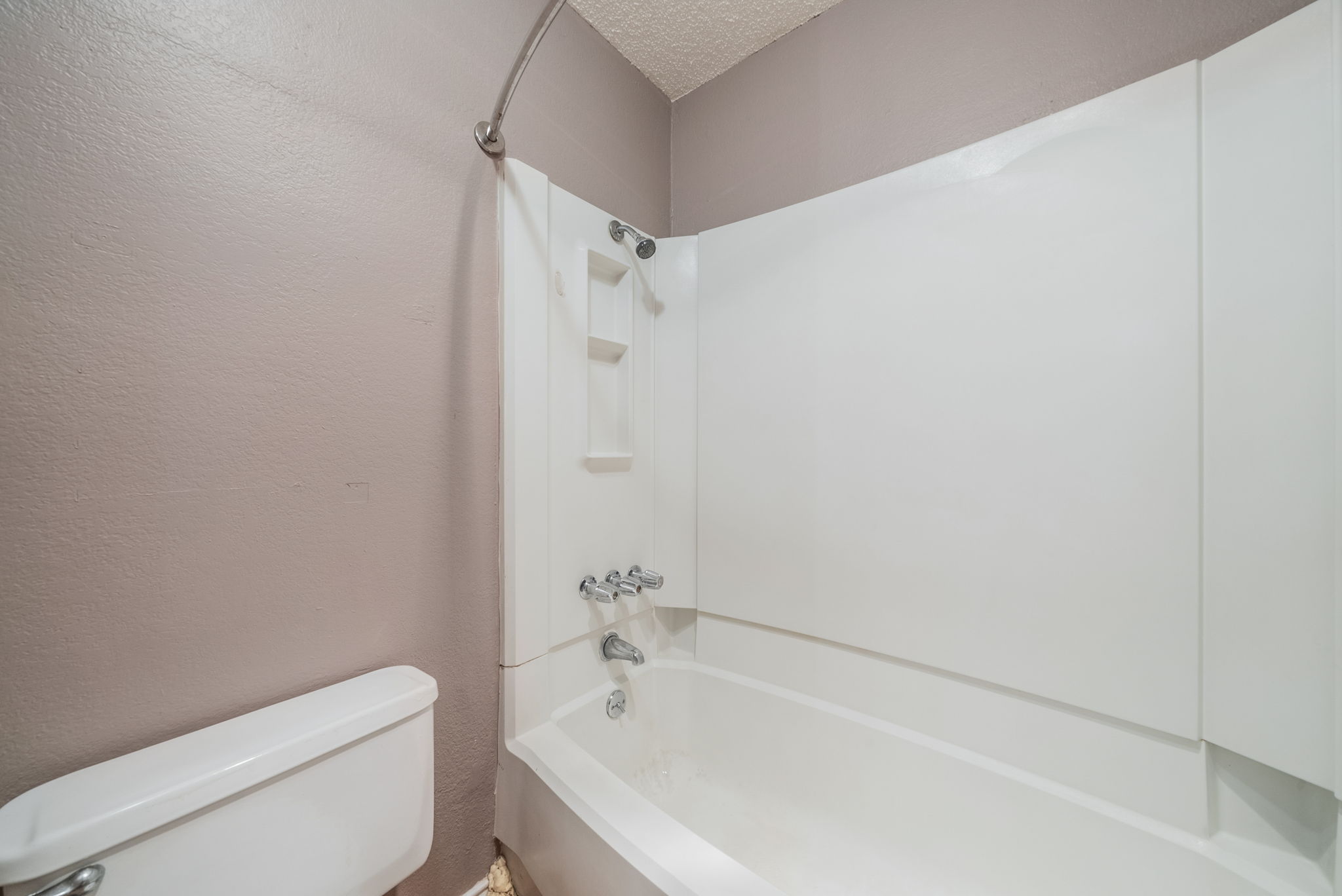 5807 Spring Meadow Road, Unit B Austin, TX 78744 - Photo 23 of 31 A well-maintained tub and shower combination offers a relaxing retreat.