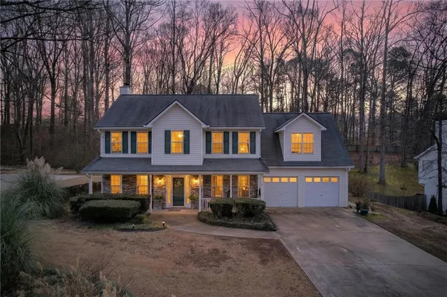 a front view of a house with yard