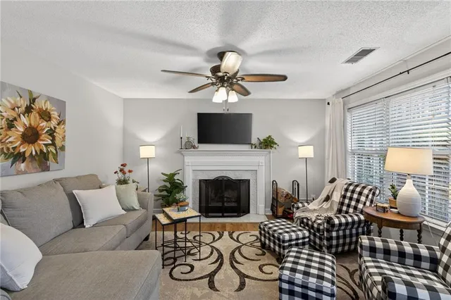 a living room with furniture and a fireplace