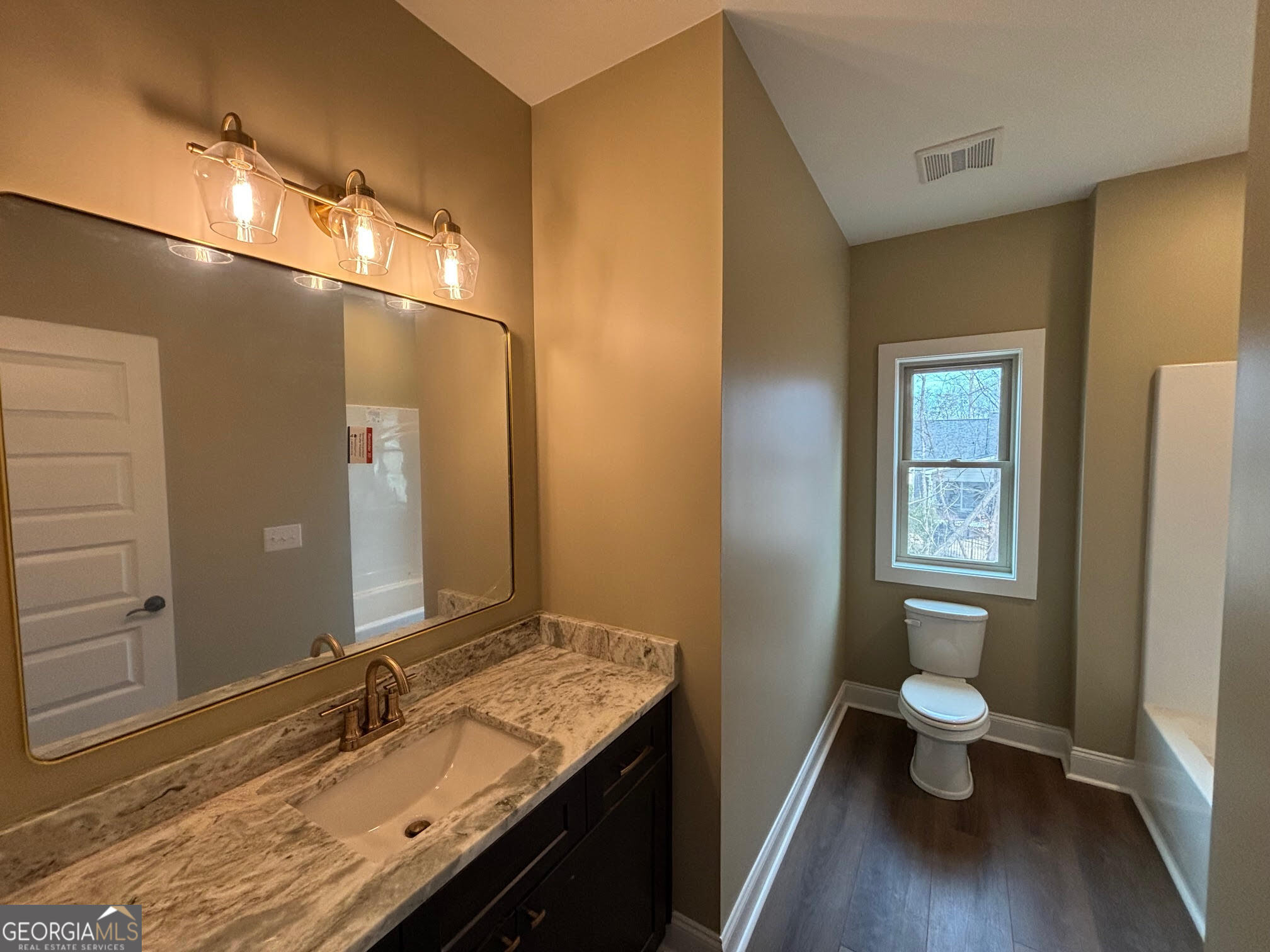 178 Samson Way Cleveland, GA 30528 - Photo 19 of 32 a bathroom with a granite countertop double vanity and a toilet