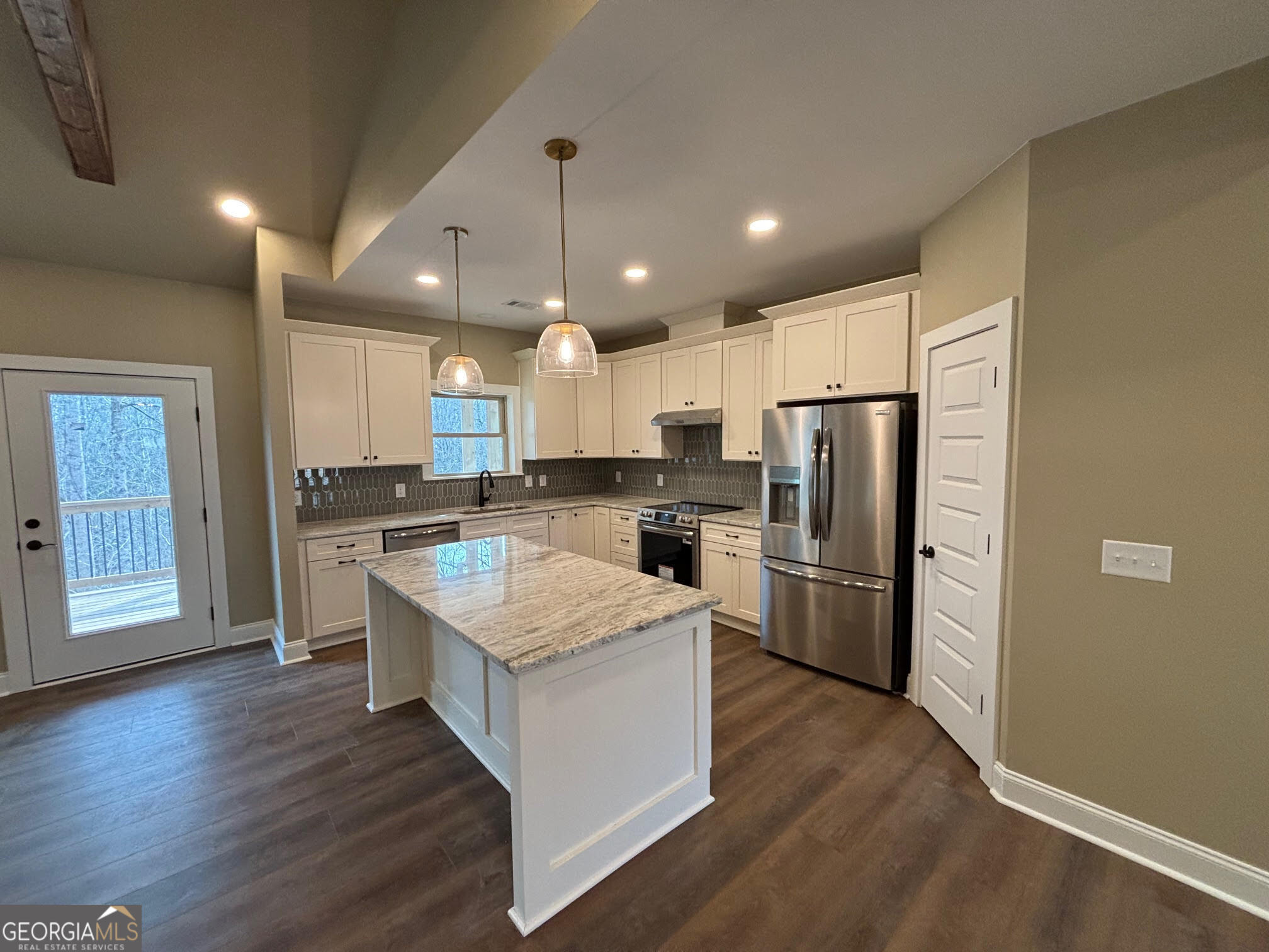 178 Samson Way Cleveland, GA 30528 - Photo 3 of 32 a kitchen with a refrigerator a sink and cabinets